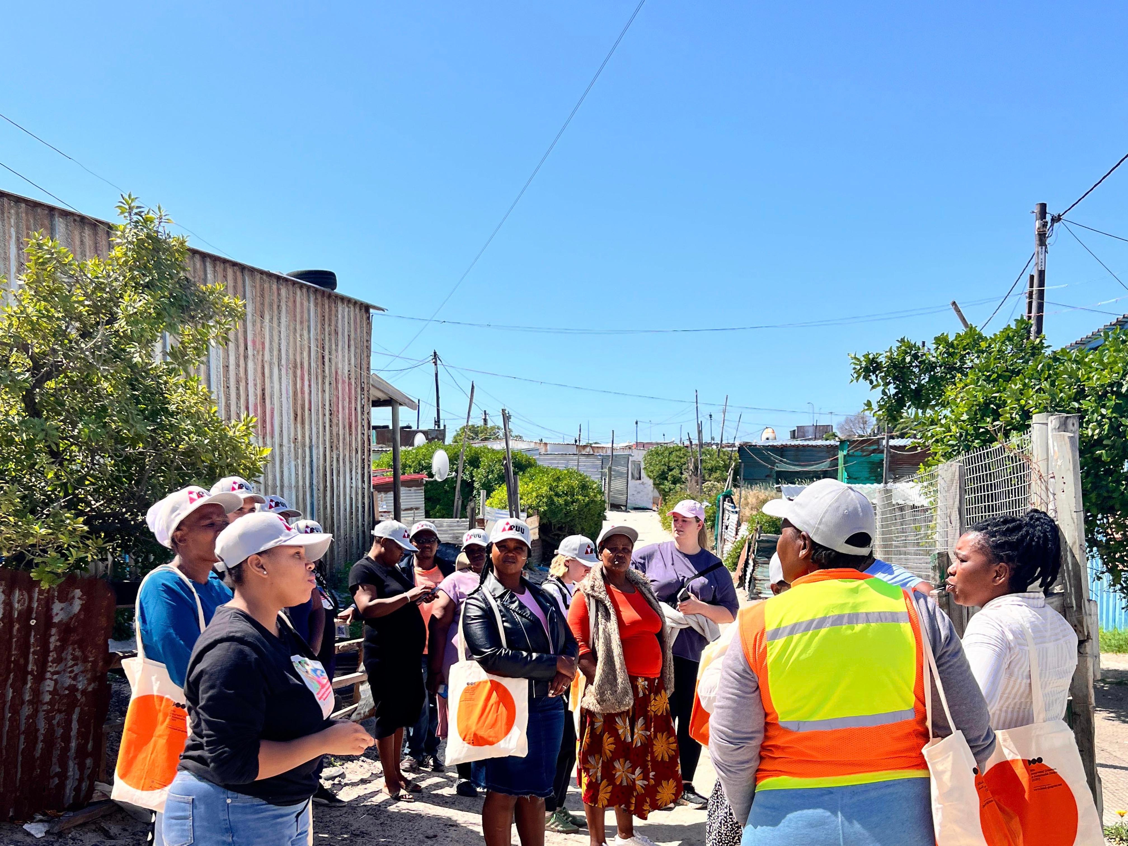 Students on transect walks through the settlement