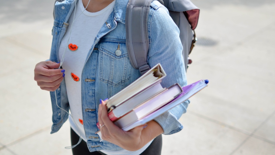 Student holding books
